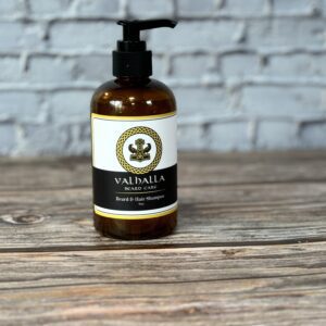 A bottle of lotion sitting on top of a wooden table.