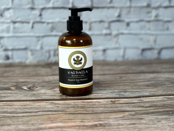 A bottle of lotion sitting on top of a wooden table.