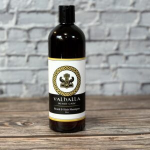 A bottle of valhalla beard oil sitting on top of a table.