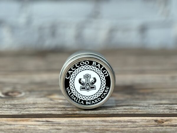 A close up of the top of a tin on a table