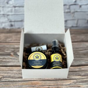 A box of beard oil and balm sitting on top of a table.