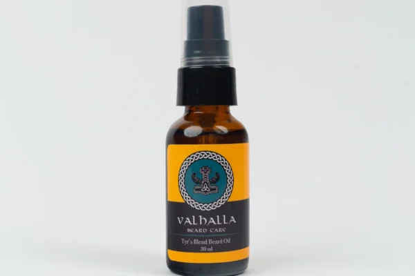 A bottle of oil with a black cap