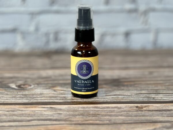 A bottle of oil sitting on top of a wooden table.
