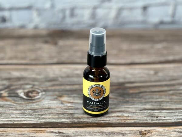 A bottle of oil sitting on top of a wooden table.