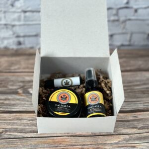 A box of beard oil and balm sitting on top of a table.