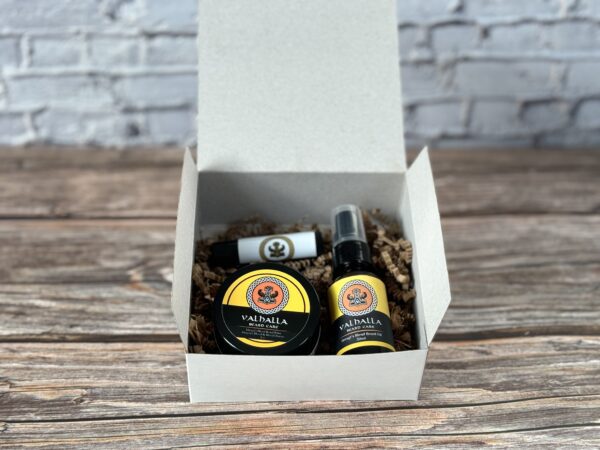 A box of beard oil and balm sitting on top of a table.