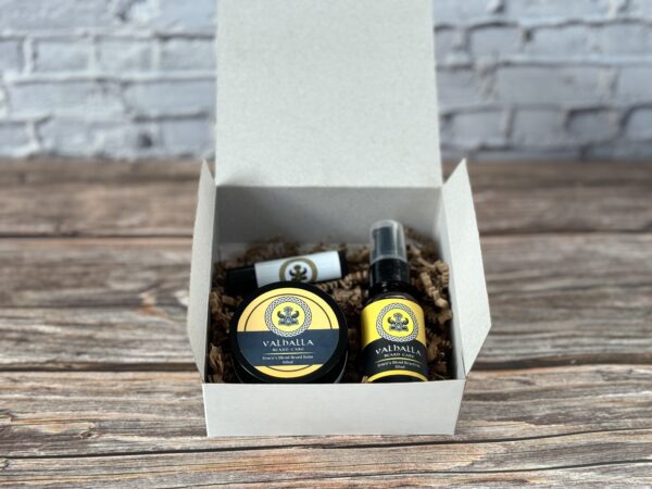 A box of beard oil and balm sitting on top of a table.