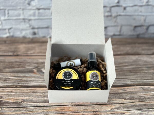 A box of beard oil and balm sitting on top of a table.