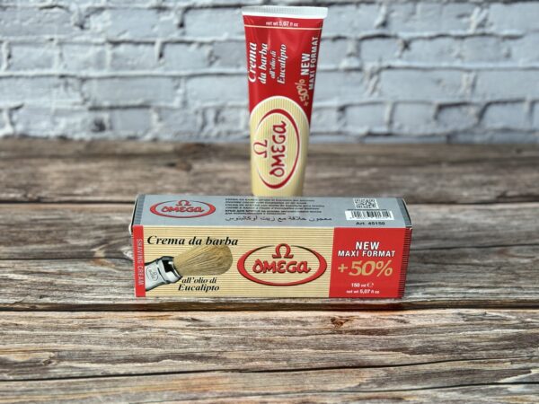 A box of omega creme de panache next to another container.