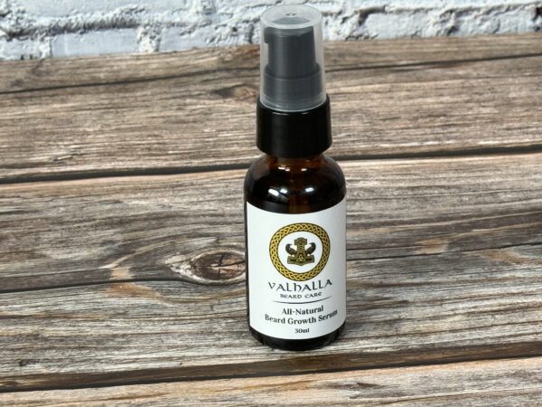A bottle of oil sitting on top of a wooden table.